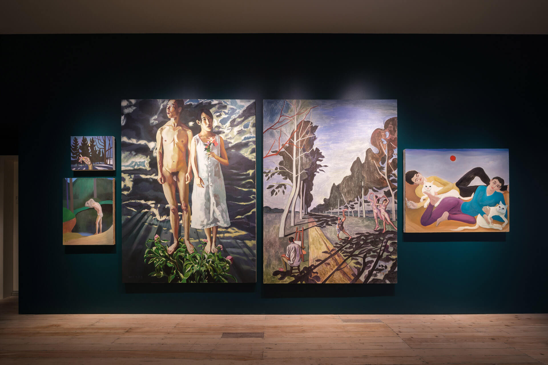 Gallery Level 2 displaying contemporary paintings including figurative works and landscape scenes with dark teal walls at White Rabbit Gallery