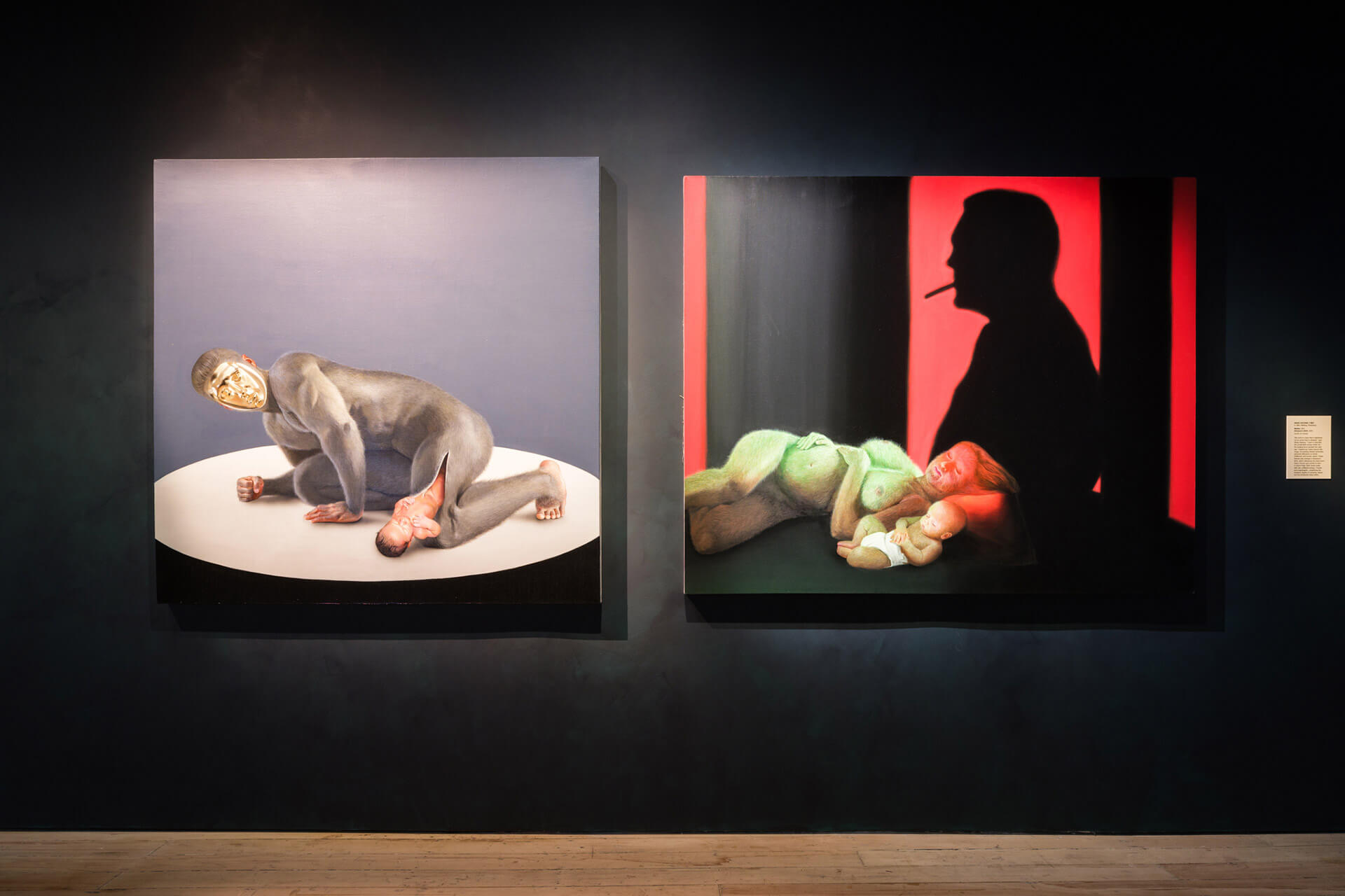 Two contemporary paintings by Wang Haiyang including "Dionysus's Birth 1" displaying figures and still life elements on dark gallery walls