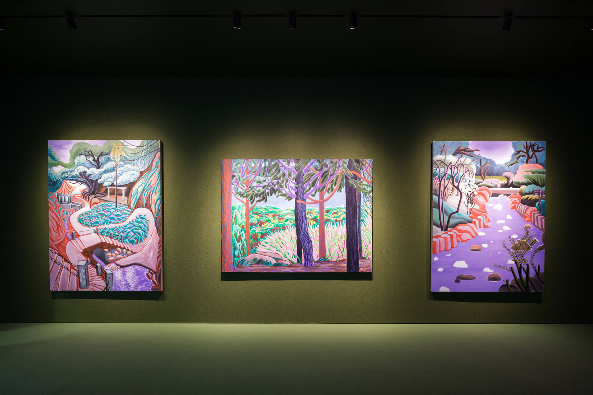 Three contemporary landscape paintings by Zhu Zi from "White Stone" series displayed on dark green gallery wall in Tender Comrade exhibition