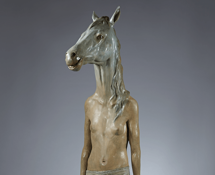 Fibreglass sculpture of a nude figure with a greenish horse head.